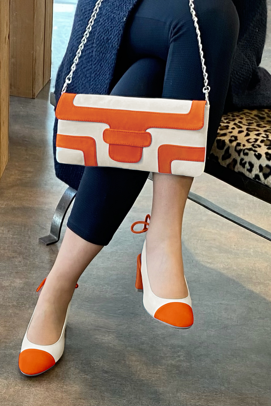 Clementine orange and off white women's slingback shoes. Round toe. Medium block heels. Worn view - Florence KOOIJMAN